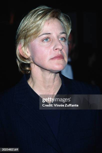 American television host and comedian Ellen DeGeneres, wearing a black suit over a black v-neck top,, attends the Los Angeles Gay & Lesbian Center's...