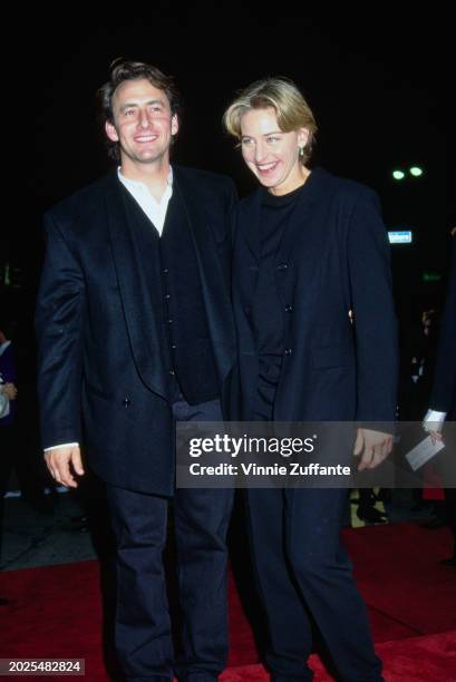 American actor Arye Gross, wearing a black suit with a black waistcoat over a white shirt, and American television host and comedian Ellen DeGeneres,...
