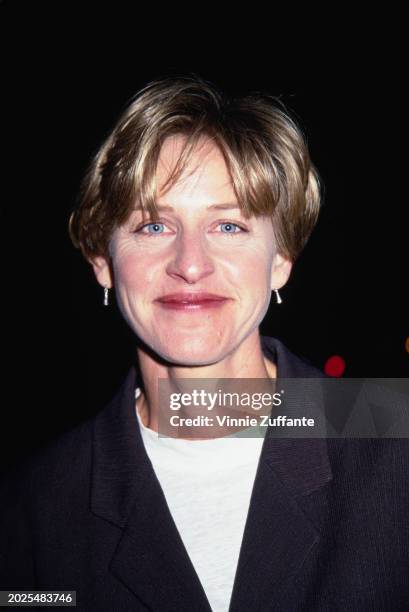 American television host and comedian Ellen DeGeneres, wearing a black jacket over a white crew-neck top, attends the Multicultural Motion Picture...