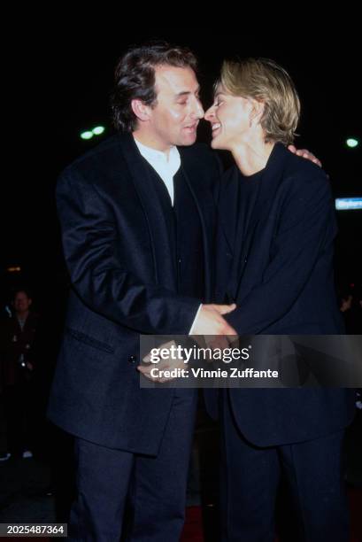 American actor Arye Gross, wearing a black suit with a black waistcoat over a white shirt, and American television host and comedian Ellen DeGeneres,...