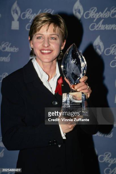 American television host and comedian Ellen DeGeneres in the press room of the 21st People's Choice Awards, held on Sound Stage 12 at Universal...