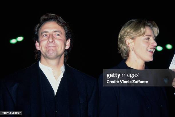 American actor Arye Gross, wearing a black suit with a black waistcoat over a white shirt, and American television host and comedian Ellen DeGeneres,...