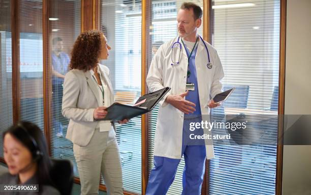 doctor meeting with sales representative - medical sales representative stock pictures, royalty-free photos & images