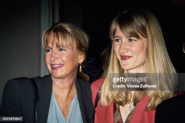American actress Diane Ladd, wearing a black jacket over a blue v-neck outfit, and her daughter, American actress Laura Dern, who wears a red outfit,...