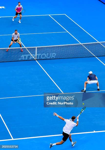 Ariel Behar of Uruguay and Adam Pavlasek of the Czech Republic are competing against Jamie Murray of Great Britain and Michael Venus of New Zealand...