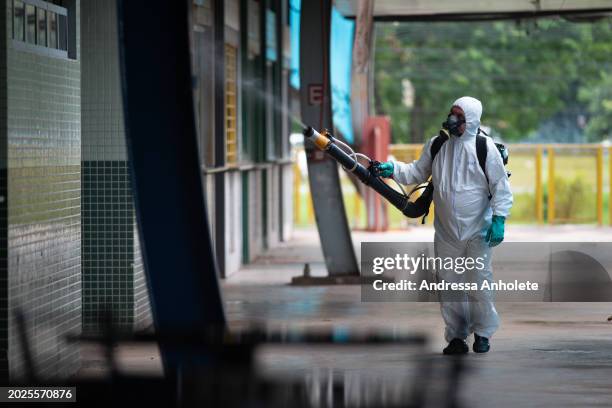 Health worker sprays insecticide during a fumigation campaign against the Aedes aegypti mosquito to combat the spread of dengue outbreak at the...