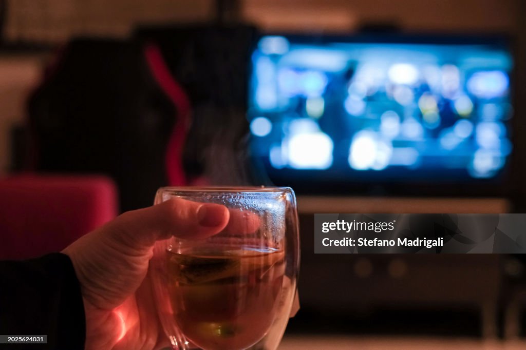 Glass of drink during a movie