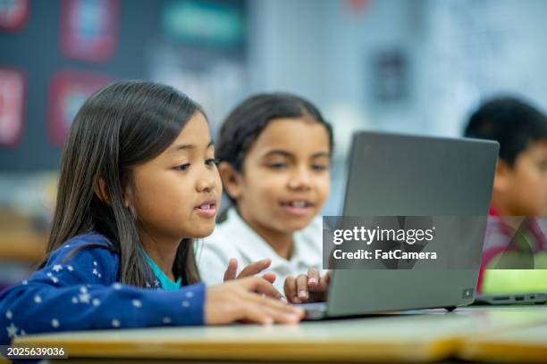 elementary computer lab - students using computers stock pictures, royalty-free photos & images