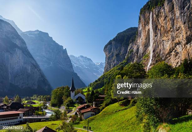 lauterbrunnen village and staubbach fall (staubbachfall) waterfall, switzerland - bernese alps stock pictures, royalty-free photos & images