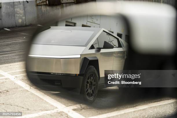 Tesla Cybertruck is reflected in a side view mirror during a test drive in Los Angeles, California, US, on Friday, Feb. 16, 2024. The Cybertruck...