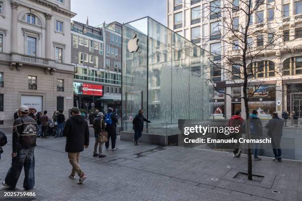 People walk past the Apple Inc. Store on February 20, 2024 in Piazza del Liberty, Milan, Italy. As reported by the Financial Times, Apple Inc. Will...