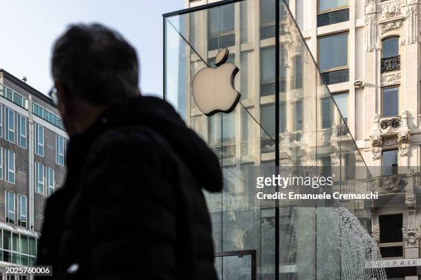 Man walks past the Apple Inc. Store on February 20, 2024 in Piazza del Liberty, Milan, Italy. As reported by the Financial Times, Apple Inc. Will...