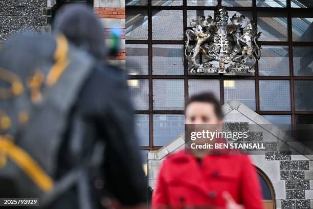 Reporter stands in front of Canterbury Crown Court in southeast England, on February 23, 2024 following the sentencing of Ibrahima Bah, a Senegalese...