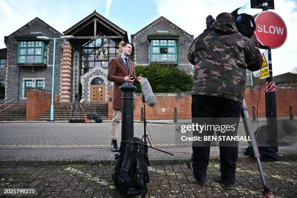 Reporter stands in front of Canterbury Crown Court in southeast England, on February 23, 2024 following the sentencing of Ibrahima Bah, a Senegalese...