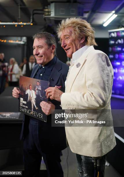 Jools Holland and Rod Stewart during a signing session for their new collaborative studio album Swing Fever, at HMV Oxford Street in London. Picture...