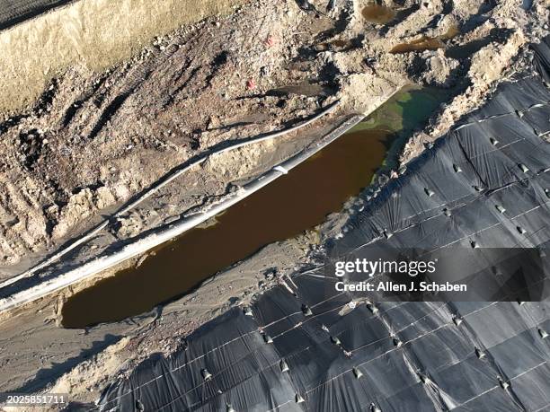 Castaic, CA An aerial view of pooled contaminated water and a large covering that will eventually stretch over roughly a 30-acre area to better...