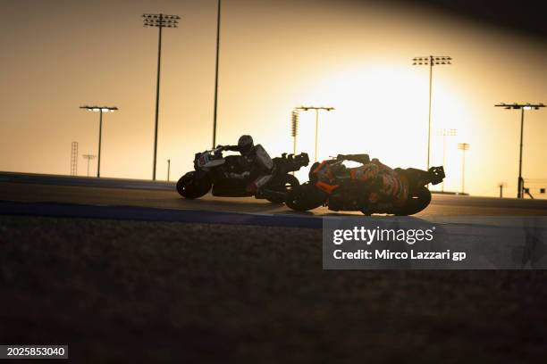 Takaaki Nakagami of Japan and IDEMITSU Honda LCR leads Jack Miller of Australia and Bull KTM Factory Racing during the Qatar MotoGP Official Test at...