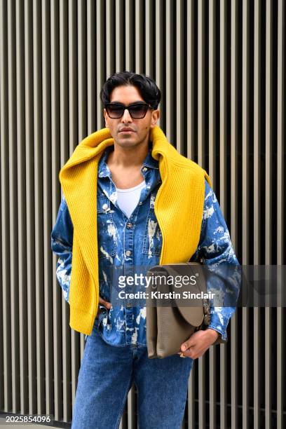 Rahi Chadda wears a Mark Fast shirt, Cos jeans, Samsoe and Samsoe jumper, Dior bag and Aspinal of London sunglasses outside the Mark Fast show during...