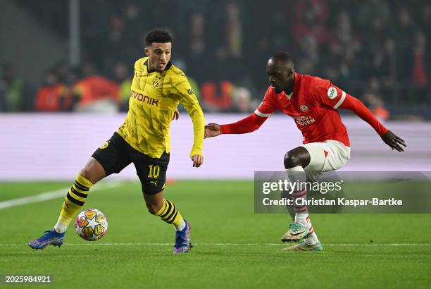 Jadon Sancho of Borussia Dortmund on the ball whilst under pressure from Jordan Teze of PSV Eindhoven during the UEFA Champions League 2023/24 round...