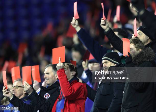 Reading fans show red cards in protest during the Sky Bet League One match between Reading and Port Vale at Select Car Leasing Stadium on February...