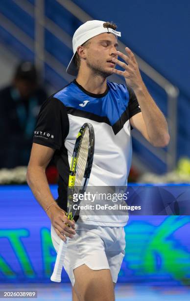 Alexandre Muller of France reacts during a first-round match against Andy Murray of United Kingdom at the ATP Qatar Exxonmobil Open tennis tournament...