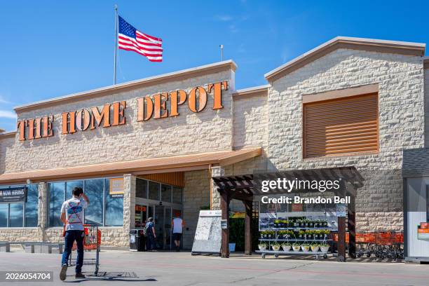 An employee returns a cart at The Home Depot store on February 20, 2024 in Austin, Texas. Home Depot has reported positive earnings and revenue,...