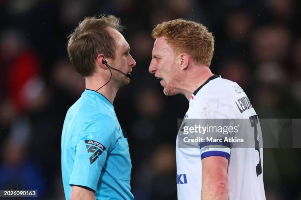 Dean Lewington of MK Dons confronts Referee Sam Purkiss before being shown a Red car during the Sky Bet League Two match between Milton Keynes Dons...