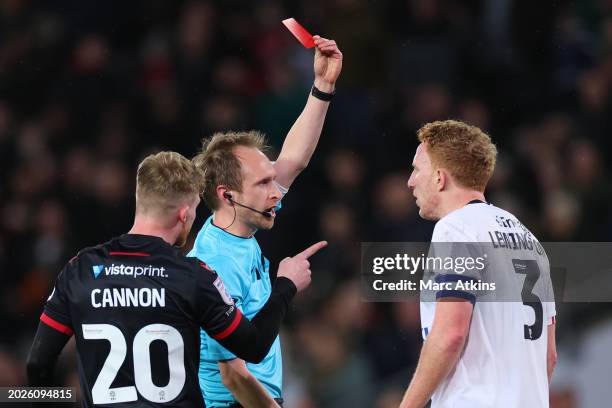 Dean Lewington of MK Dons is shown a Red card by Referee Sam Purkiss during the Sky Bet League Two match between Milton Keynes Dons and Wrexham at...