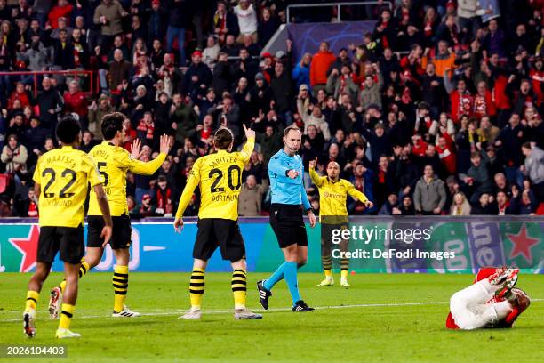 Referee Srdjan Jovanovic points to the penalty spot after a foul inside the box during the UEFA Champions League 2023/24 round of 16 first leg match...