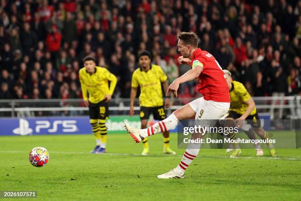 Luuk de Jong of PSV Eindhoven scores his team's first goal from the penalty-spot during the UEFA Champions League 2023/24 round of 16 first leg match...