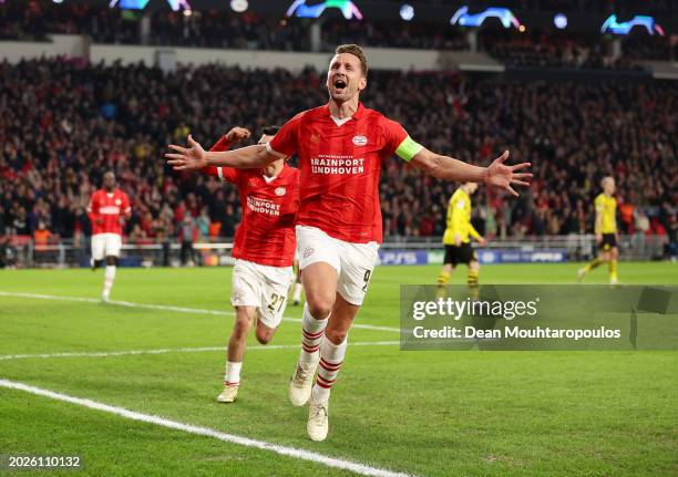 Luuk de Jong of PSV Eindhoven celebrates scoring his team's first goal from the penalty-spot during the UEFA Champions League 2023/24 round of 16...