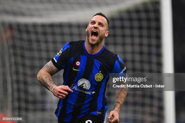 Marko Arnautovic of FC Internazionale celebrates after scoring their team's first goal during the UEFA Champions League 2023/24 round of 16 first leg...