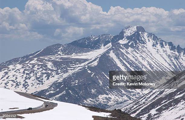 Cars drive down the Trail Ridge Road May 23, 2003 in Rocky Mountain National Park, Colorado. The road was opened for the season May 23 after crews...