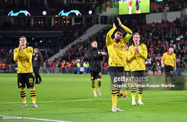 Emre Can of Borussia Dortmund applauds the fans at full-time following the team's draw in the UEFA Champions League 2023/24 round of 16 first leg...