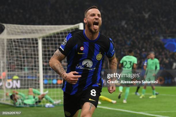 Marko Arnautovic of FC Internazionale celebrates after scoring the opening goal during the UEFA Champions League 2023/24 round of 16 first leg match...