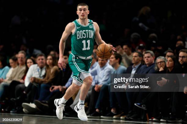 Payton Pritchard of the Boston Celtics controls the ball during the second half against the Brooklyn Nets at Barclays Center on February 13, 2024 in...