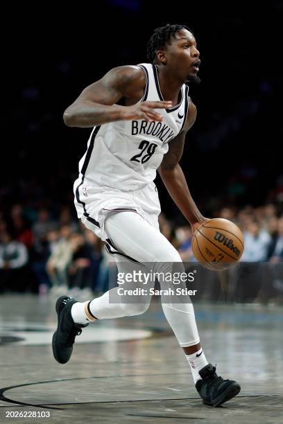 Dorian Finney-Smith of the Brooklyn Nets controls the ball during the first half against the Boston Celtics at Barclays Center on February 13, 2024...