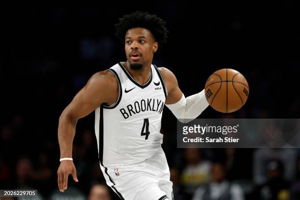 Dennis Smith Jr. #4 of the Brooklyn Nets dribbles during the second half against the Boston Celtics at Barclays Center on February 13, 2024 in the...