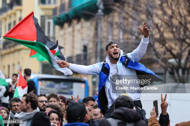 Man with a small Palestinian flag during the demonstration in Naples, in solidarity with the Palestinian people, and against the massive Israeli...