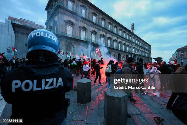 Policeman controls the procession of people, during the demonstration in Naples, in solidarity with the Palestinian people, and against the massive...