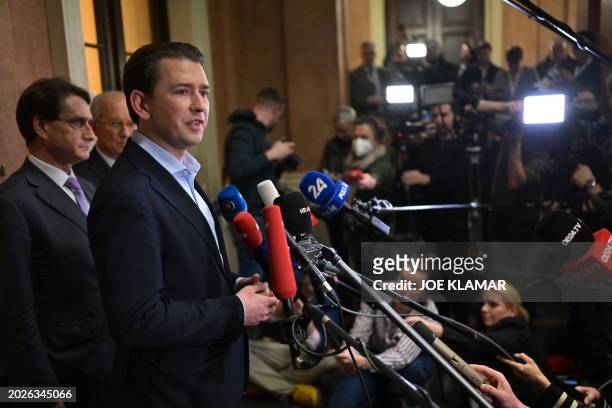 Austria's former Chancellor Sebastian Kurz speaks to journalists as he leaves the court after his trial at the Regional Criminal Court of Vienna,...