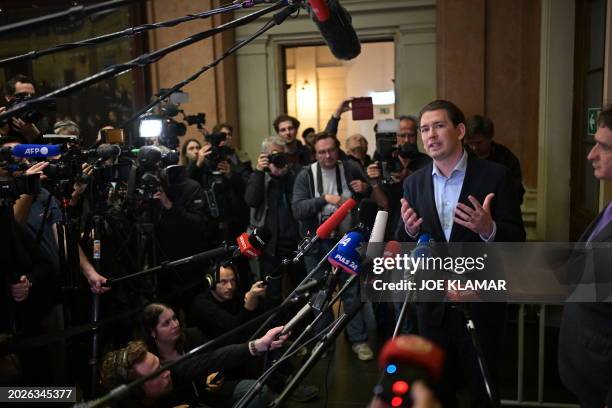 Austria's former Chancellor Sebastian Kurz speaks to journalists as he leaves the court after his trial at the Regional Criminal Court of Vienna,...