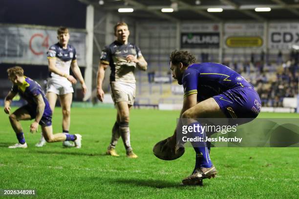 Toby King of Warrington Wolves scores his team's fourth try during the Betfred Super League match between Warrington Wolves and Hull FC at The...
