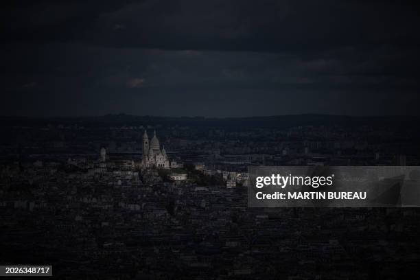 This photograph taken on February 23 shows the Basilique du Sacre Coeur in a ray of sunlight in Paris.