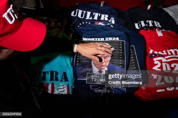 An attendee looks at t-shirts in the expo hall during the Conservative Political Action Conference in National Harbor, Maryland, US, on Friday, Feb....