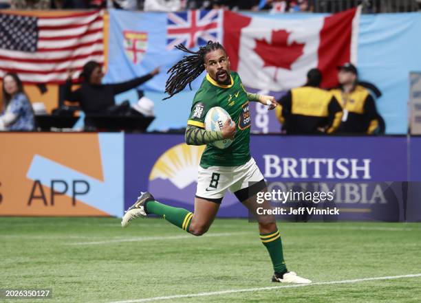 Selvyn Davids of South Africa scores a try in their match against New Zealand during day one of the HSBC World Rugby Sevens Series - Vancouver at BC...