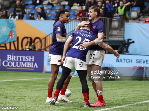 Antoine Dupont of France congratulates teammate Esteban Capilla after a try in their match against USA during day one of the HSBC World Rugby Sevens...