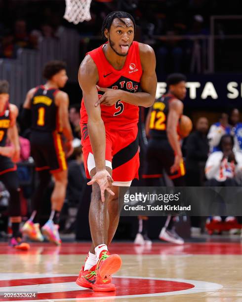 Immanuel Quickley of the Toronto Raptors reacts after a three pointer during the first quarter against the Atlanta Hawks at State Farm Arena on...