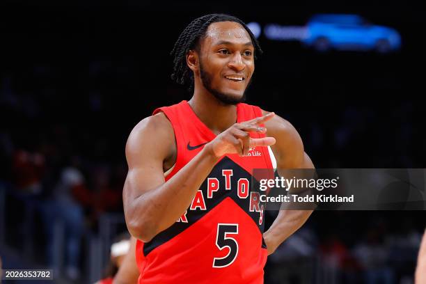 Immanuel Quickley of the Toronto Raptors reacts after a three pointer during the first quarter against the Atlanta Hawks at State Farm Arena on...