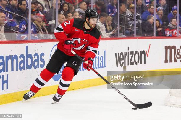 New Jersey Devils defenseman Brendan Smith skates with the puck during a game between the against the New York Rangers and New Jersey Devils on...